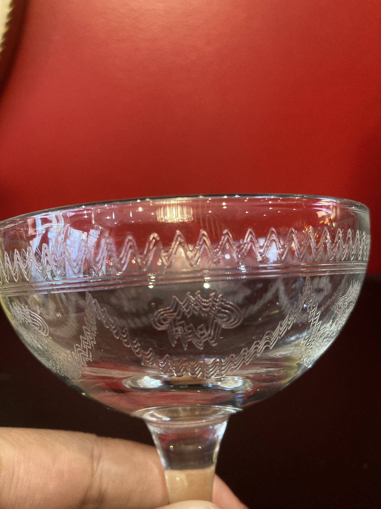 Early 20th century champagne glass burst by hand