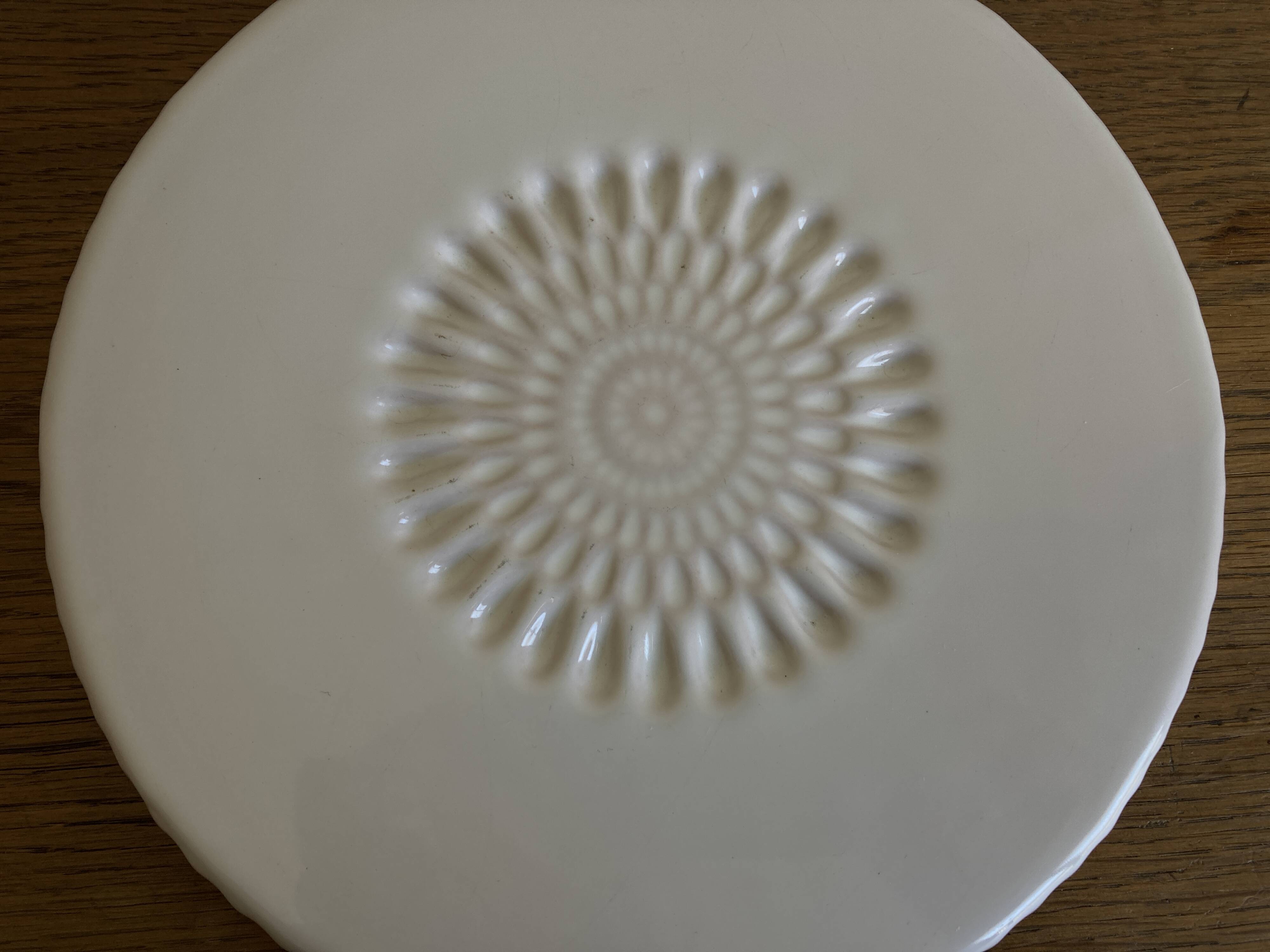 Pierre Motton glazed earthenware scalloped trivet for Gien