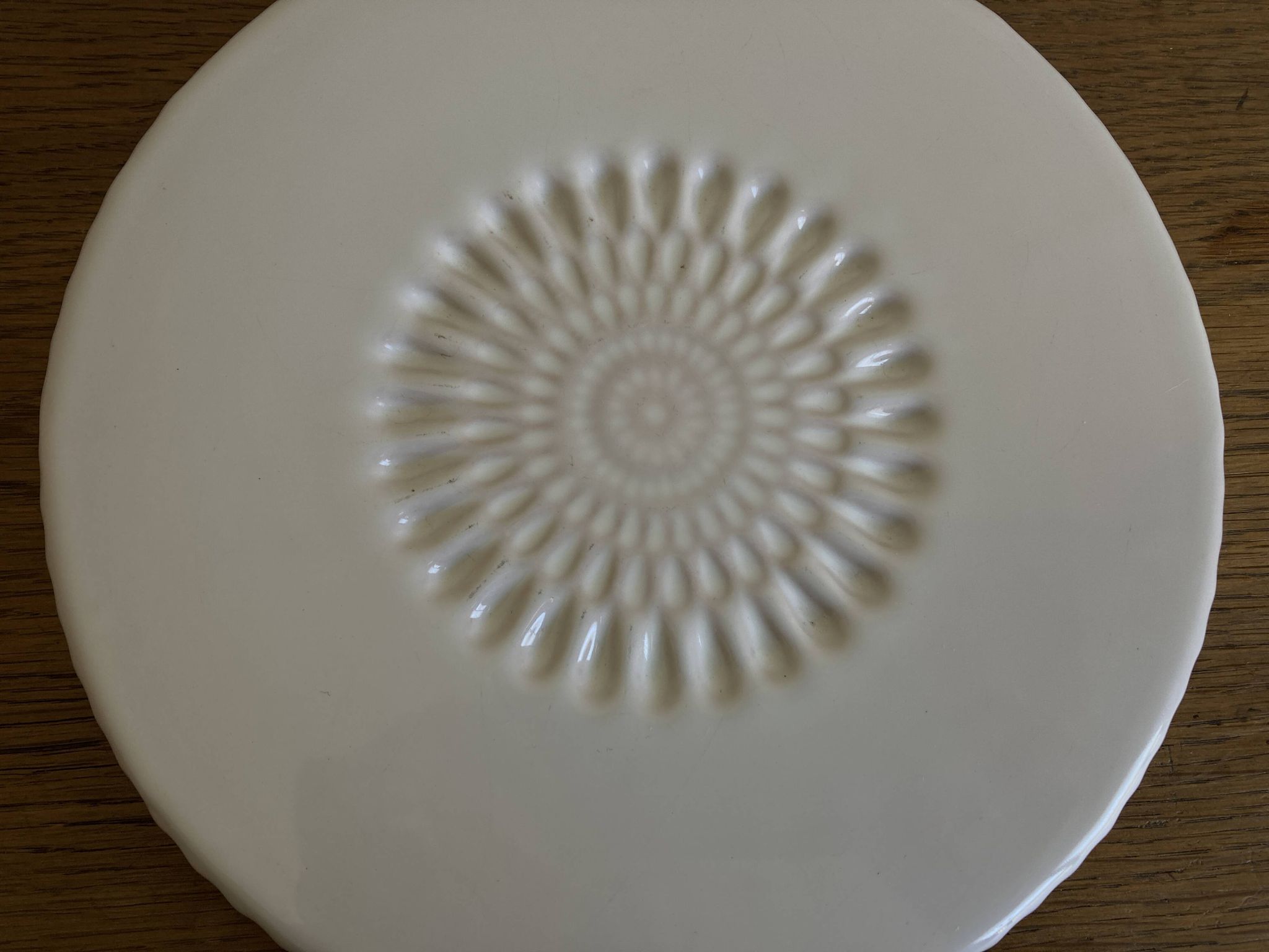 Pierre Motton glazed earthenware scalloped trivet for Gien