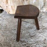 Old vintage wooden tripod milking stool
