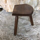 Old vintage wooden tripod milking stool