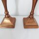 Set of a pair of candle holders and a hand candle holder