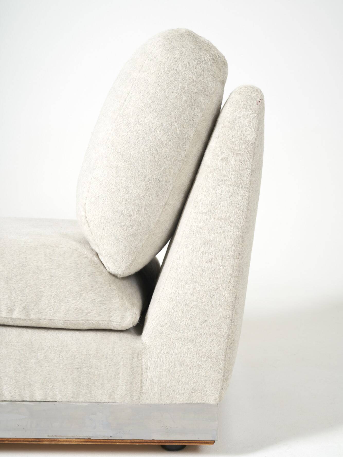 Beige fireside chair by Jacques Charpentier