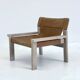 Stylish vintage armchair with saddle leather seat