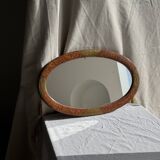 Small oval Art Deco mirror in brown and gold 33x54.