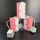 Set of 3 vintage 1950s pink and white plexiglass pendants.