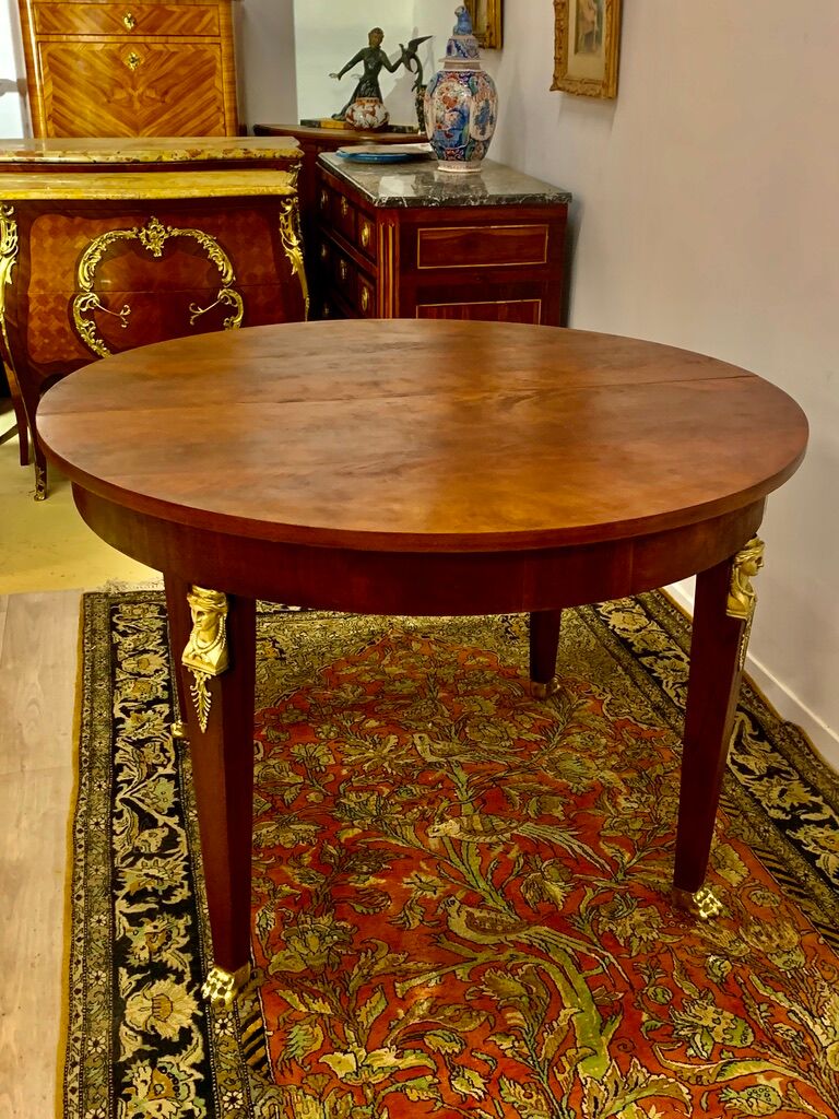 Empire style round table in mahogany