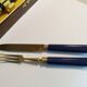Antique cake service in metal and blue bakelite