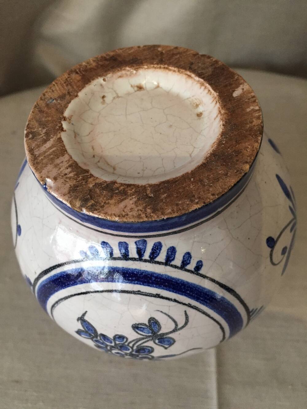 Small white decorative vase with blue floral decoration