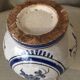 Small white decorative vase with blue floral decoration
