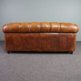 Sheepskin sofa with decorative nails