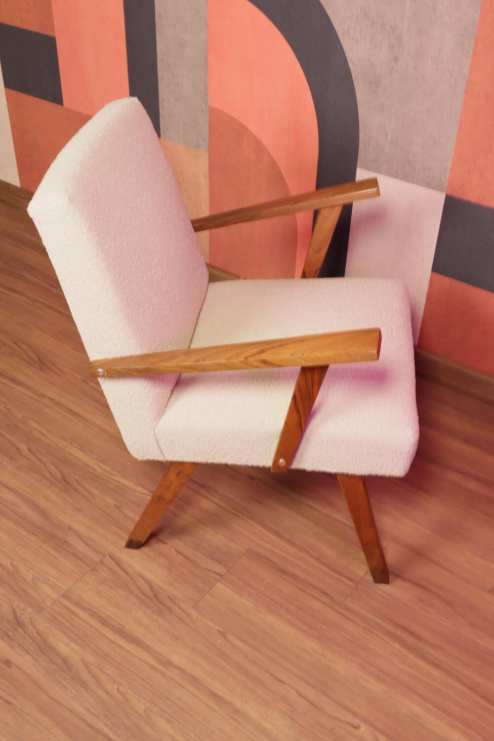 Vintage beige bouclé armchair with walnut wood from the 1950s.
