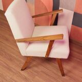 Vintage beige bouclé armchair with walnut wood from the 1950s.