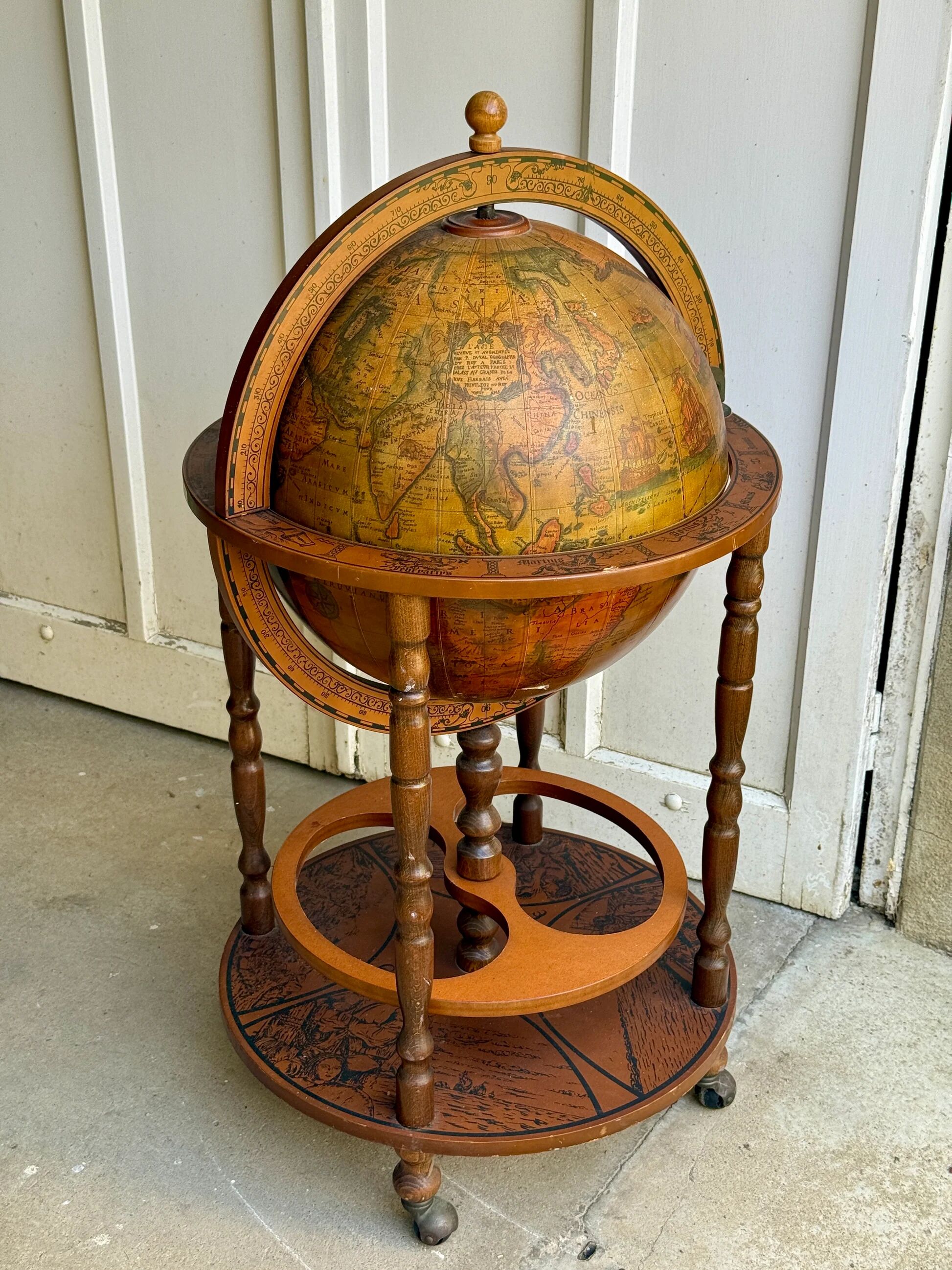 Globe bar on wheels with a rotating tray