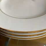 White porcelain dinner plates with a golden thread