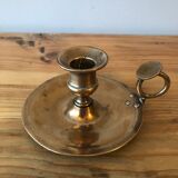 Old copper hand-held candlestick