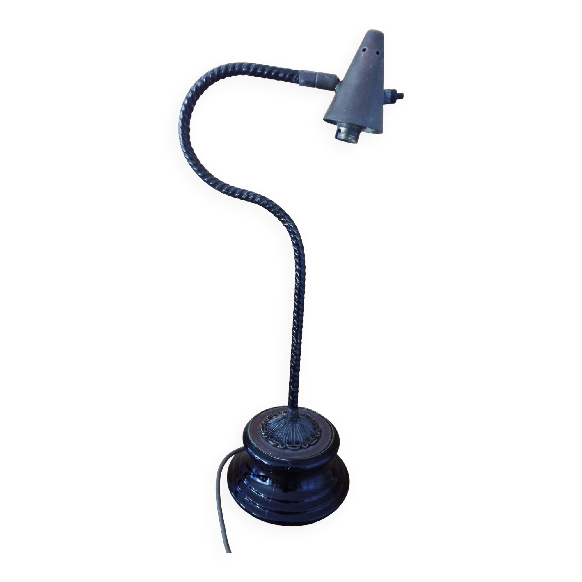 Old desk lamp with a small copper shade and a porcelain base.