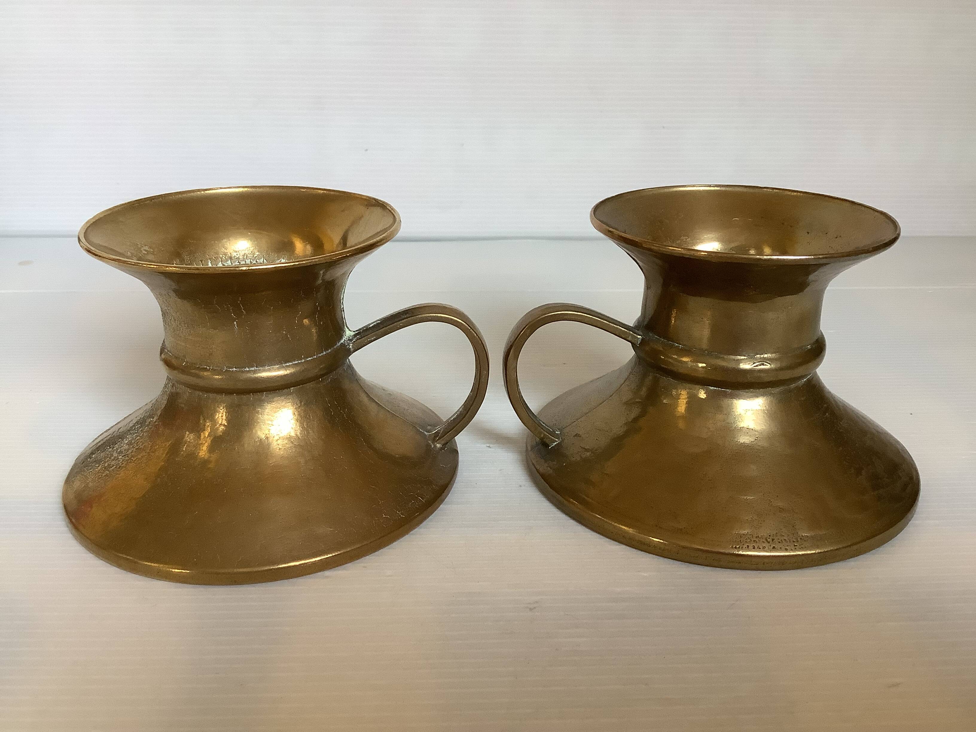 Pair of rat cave candlesticks with tulip base in bronze.