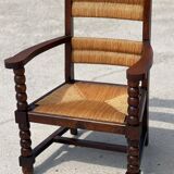 Pair of stained oak and straw armchairs, French work, 1950