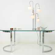 Dining table with a circular base.