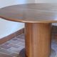 Round table with a central pedestal, light wood, 1990s.