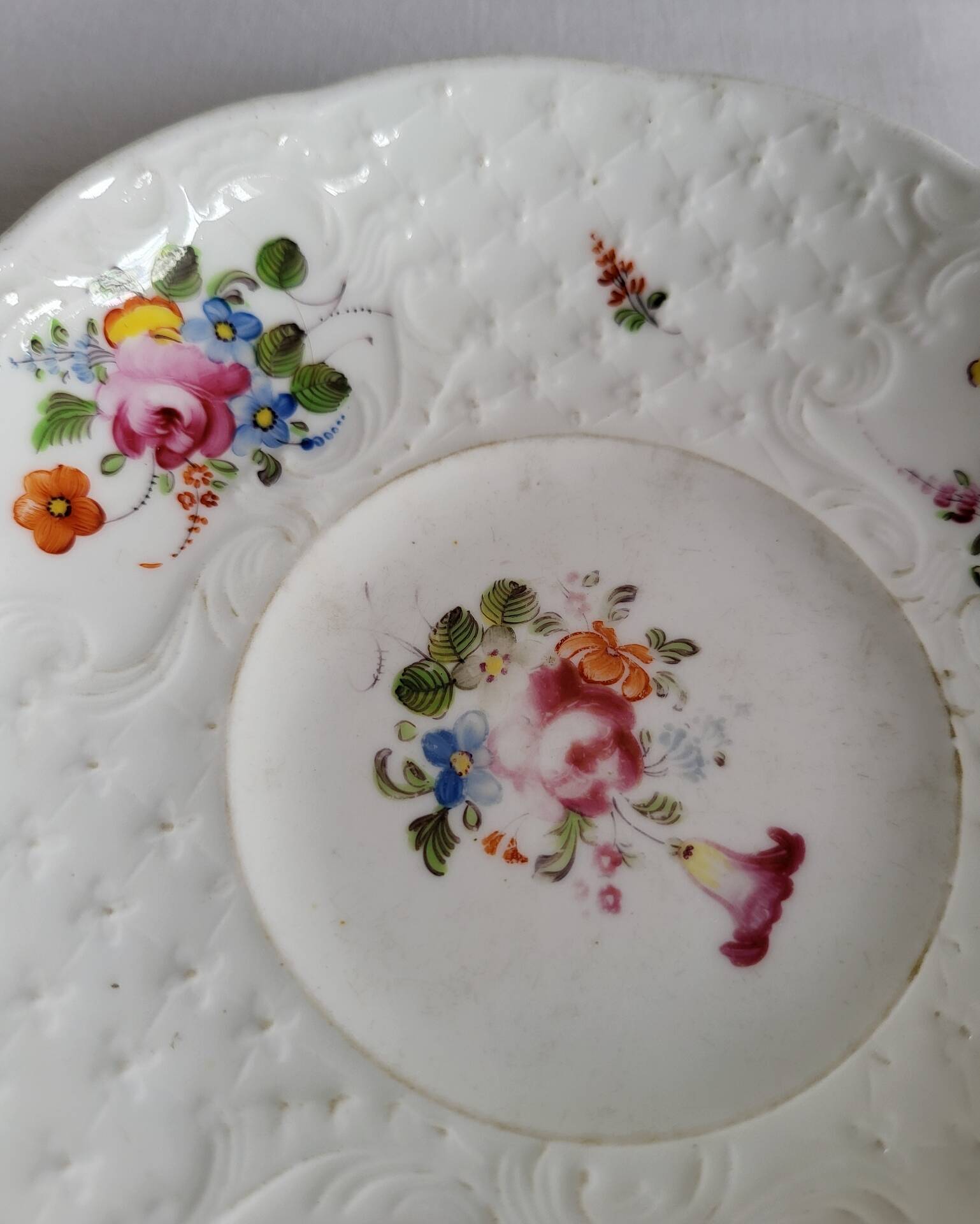 Antique Cup and Saucer in Porcelain with Hand-Painted Floral Decoration