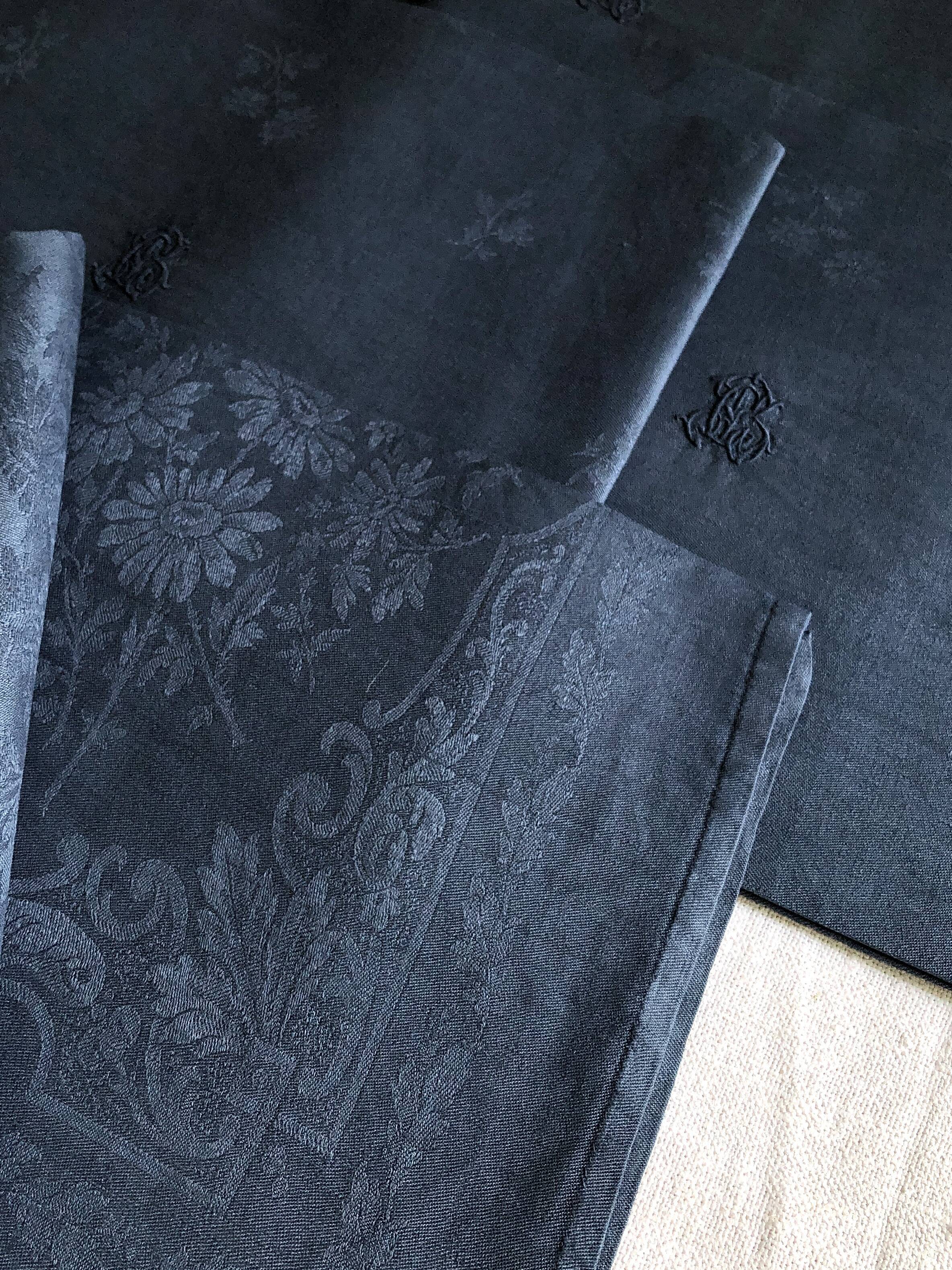 Lot four damasked and monogrammed towels linen and night blue silk