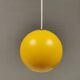 Spherical pendant lamp in sunny yellow.