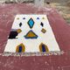 Moroccan Berber rug in cream and blue 250x150 cm – colourful geometric patterns