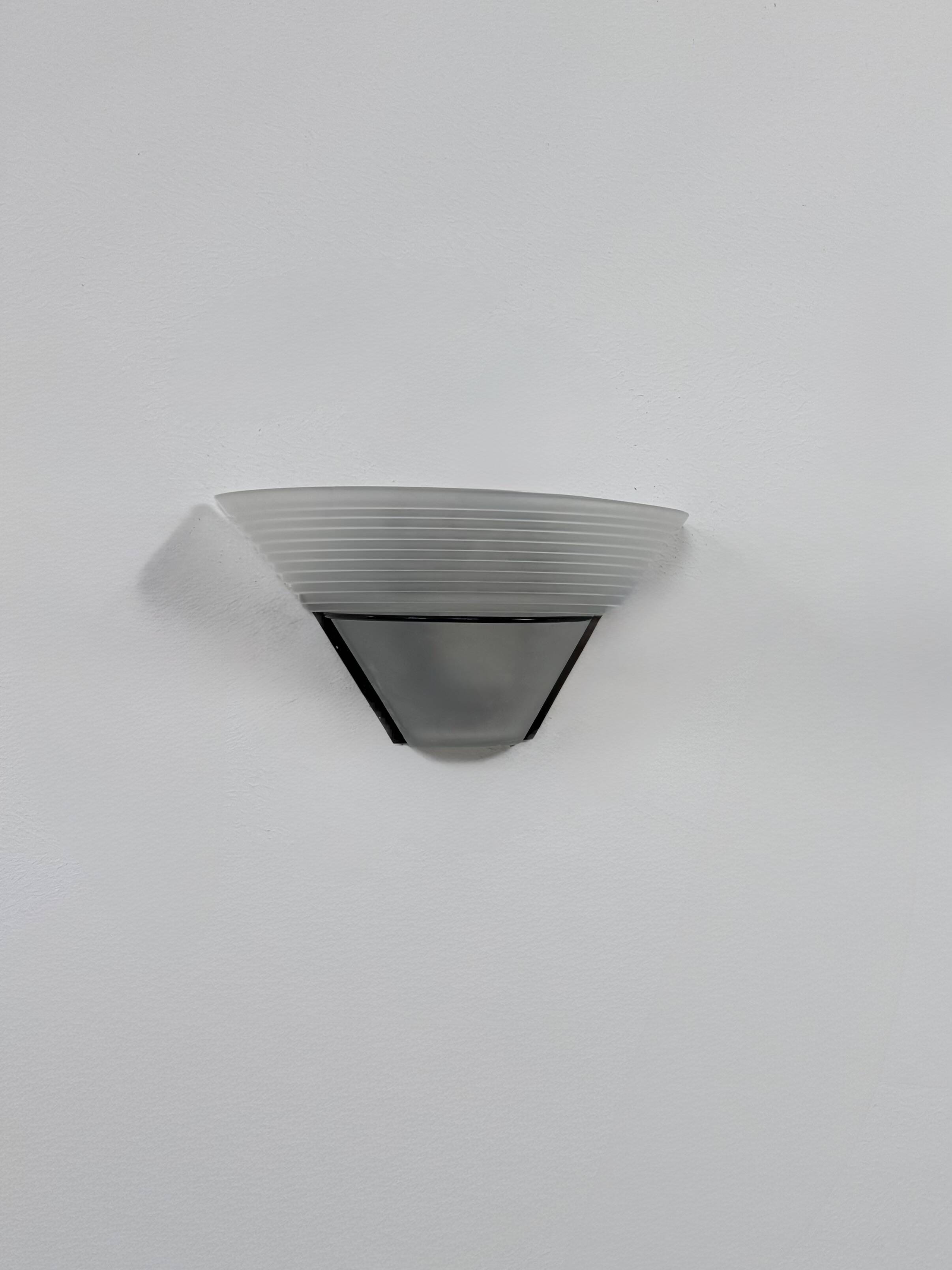 Frosted glass and black metal wall light, Italy, 1980.