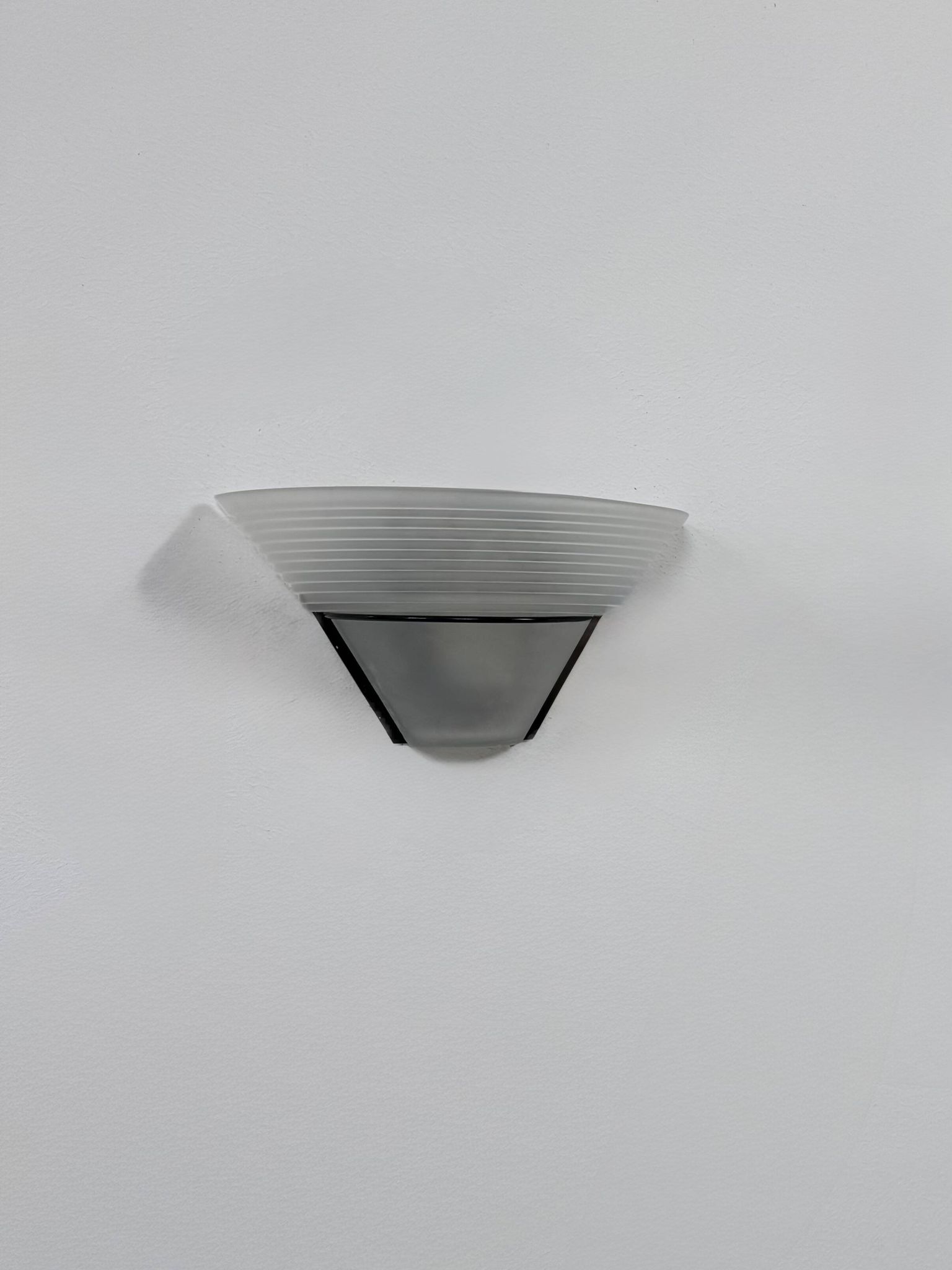 Frosted glass and black metal wall light, Italy, 1980.