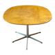 Dining table with a star-shaped six-legged base by Arne Jacobsen for Fritz Hansen.