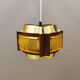 Danish hanging lamp, made in brass colored and brown metal, with yellowish hard pressed plastic deta