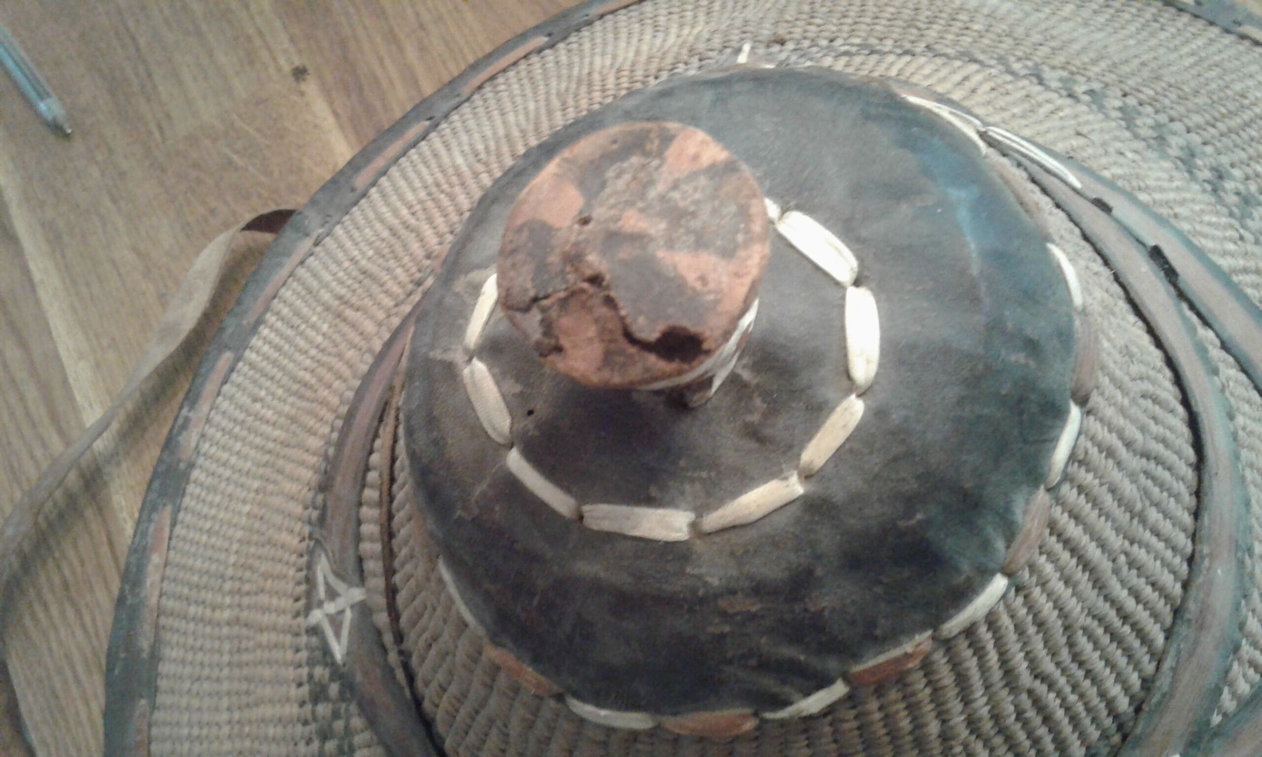 Old colonial hat in braided straw and leather