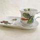 Tea cup, solitary service, naturalistic decoration, in Limoges porcelain.