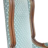 Pair of Louis XV style wingback armchairs with five legs.