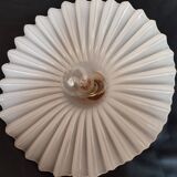 Round pendant light in pleated semi-opaque glass