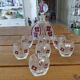 Vintage liqueur service in decorated red glass – decanter and 7 glasses