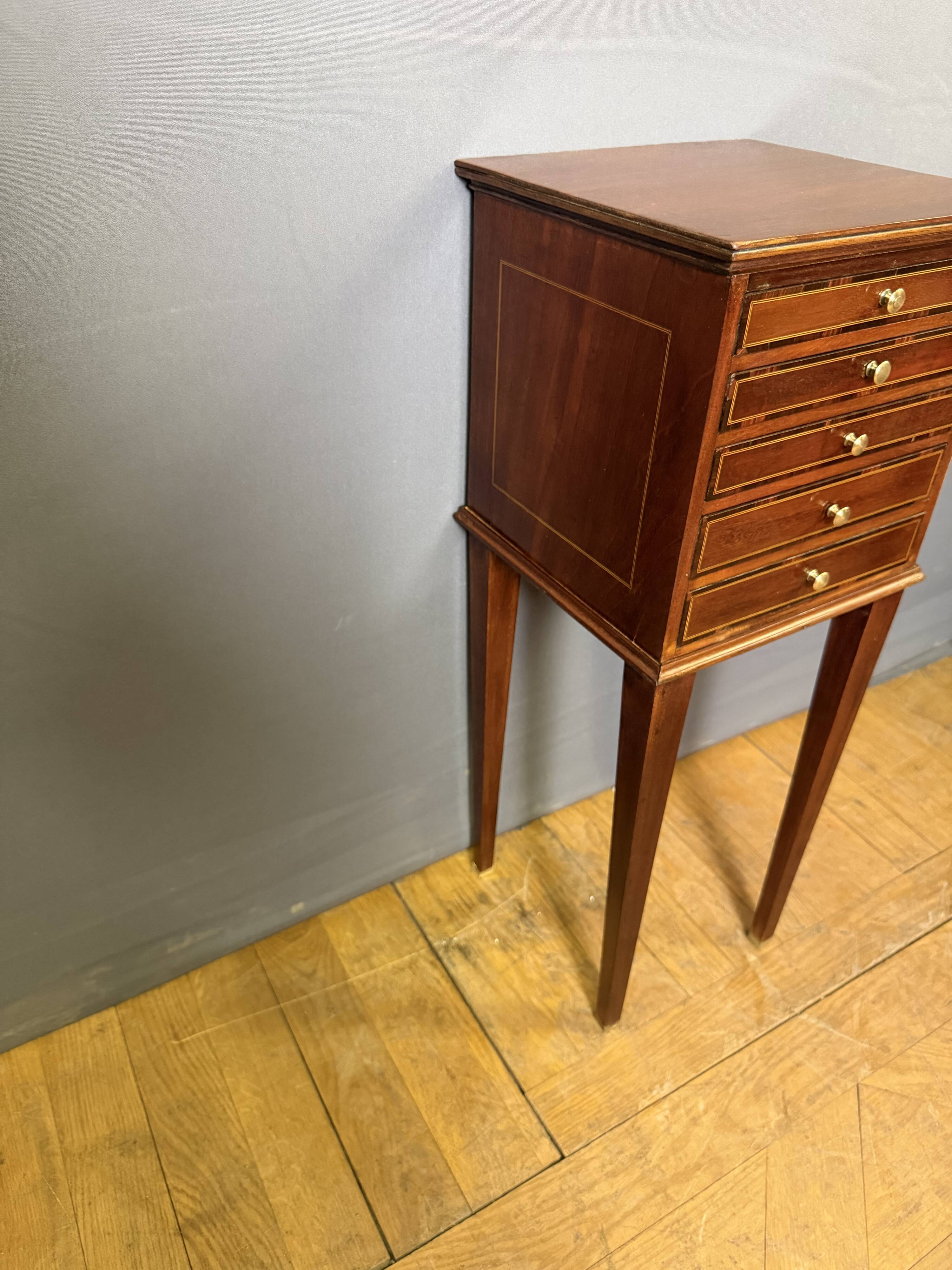 Louis XVI bedside table in mahogany with five drawers.