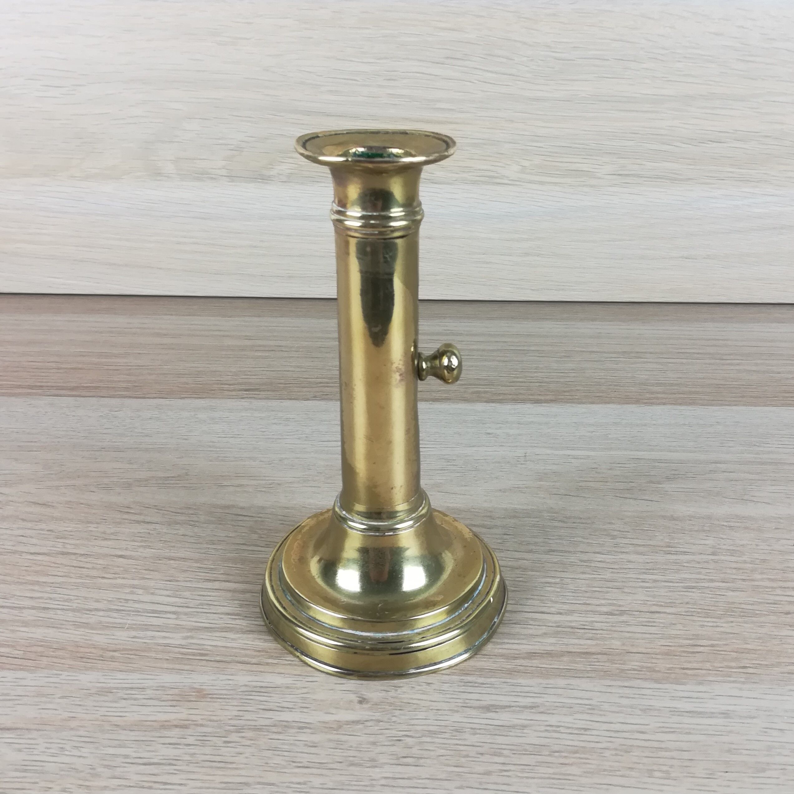 Brass pusher candle holder