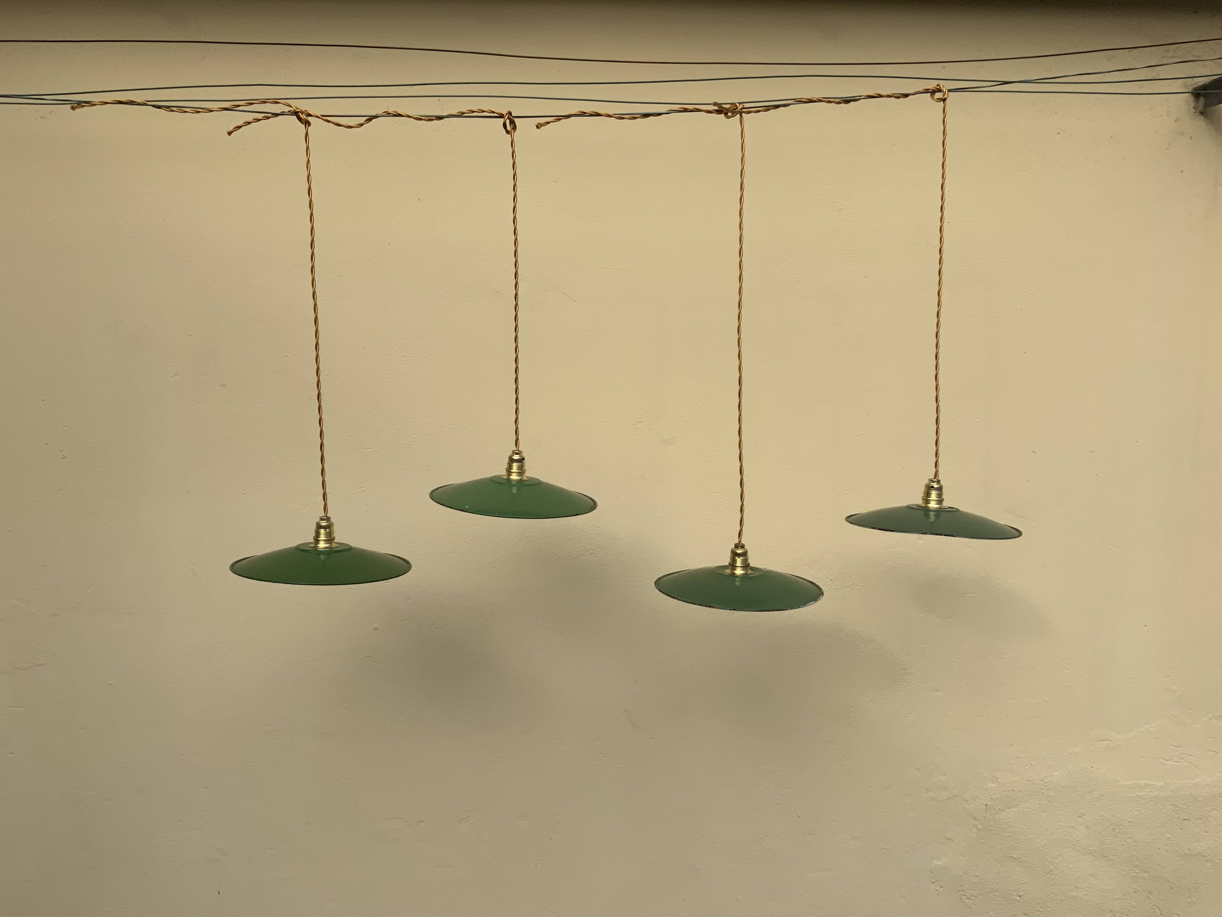 Vintage industrial enameled sheet metal pendant lights with golden wires, old green and white lampshade