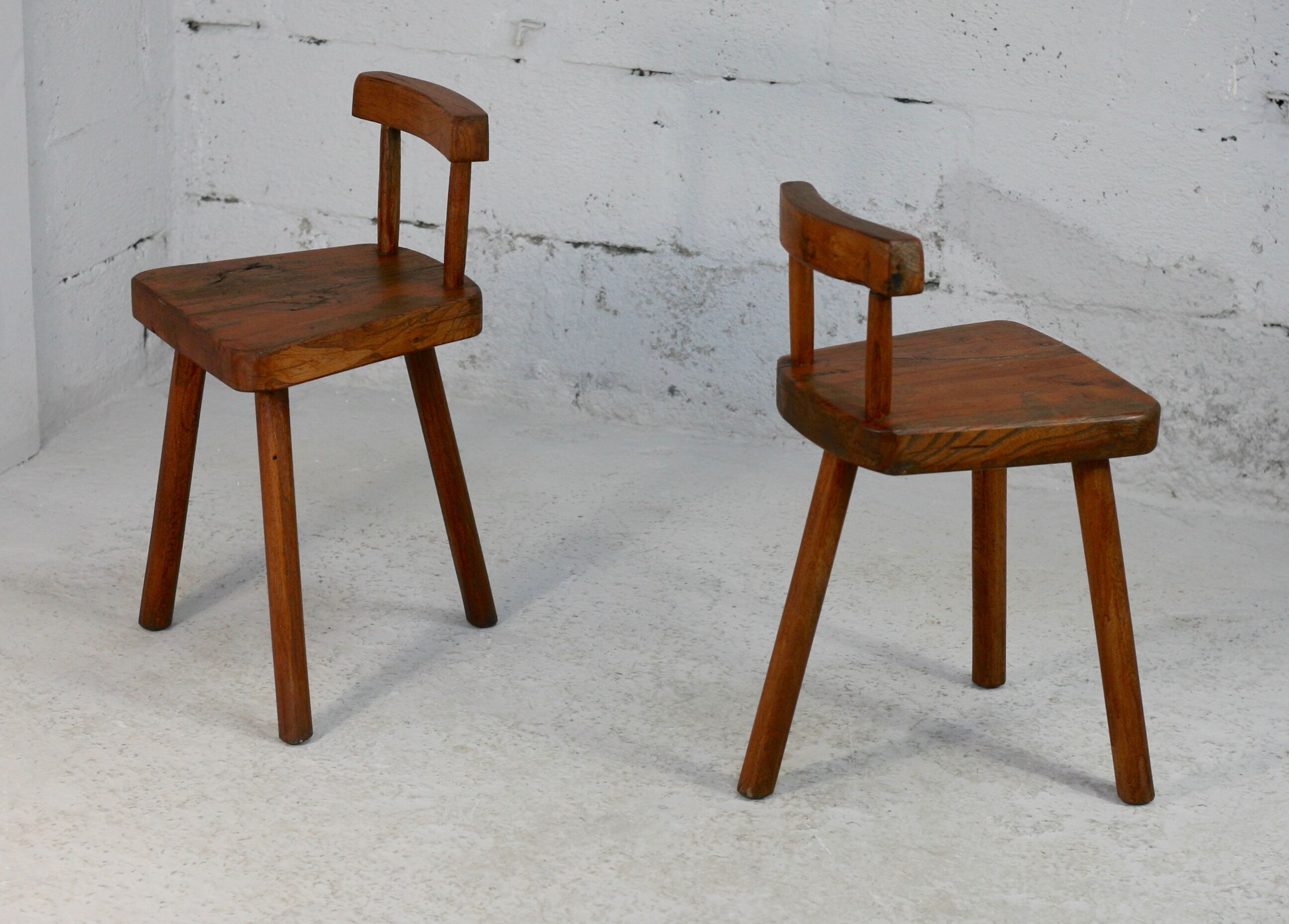 Pair of tripod stools with brutalist backrests, France, circa 1960