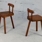 Pair of tripod stools with brutalist backrests, France, circa 1960