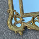 Large mirror with carved and gilded wooden frame, in Regency style.
