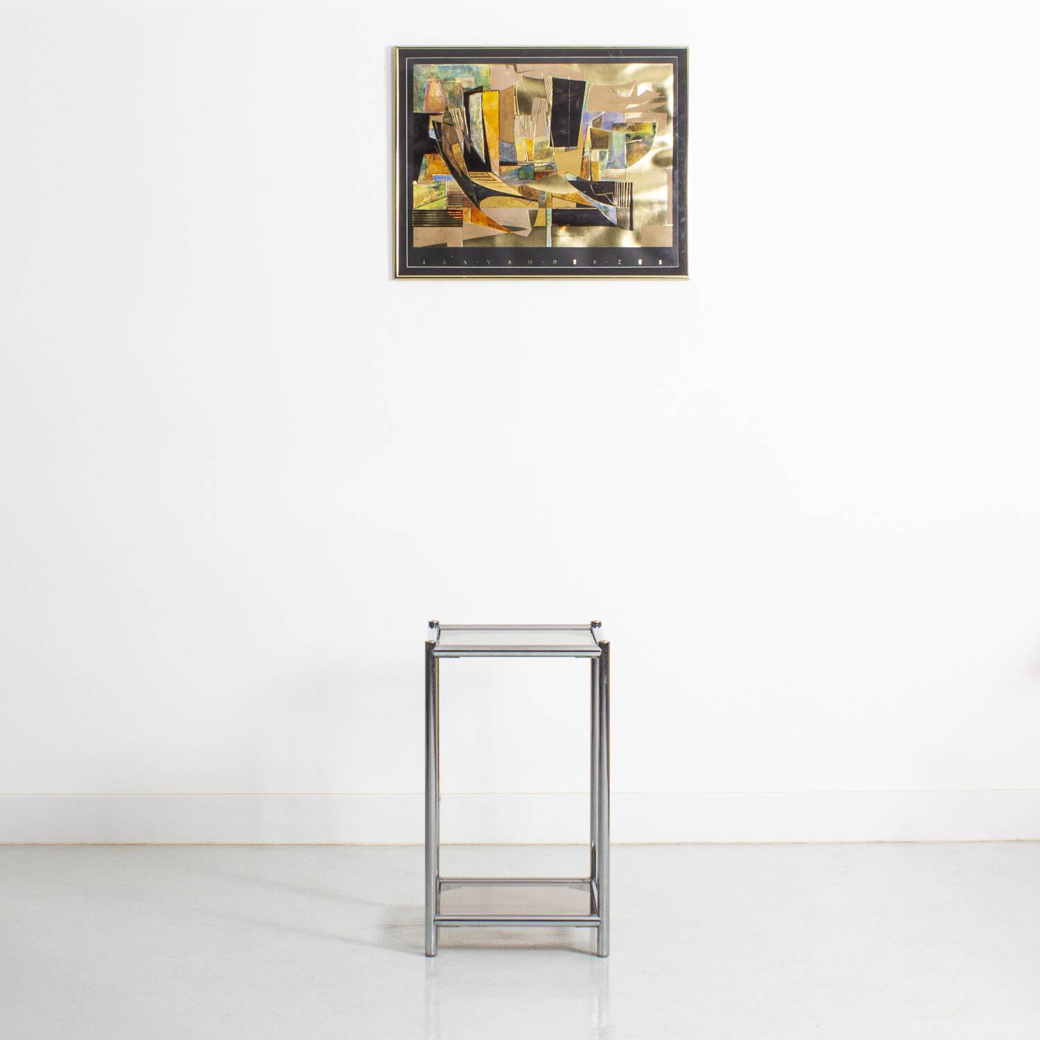Bolster or end table in chrome steel with smoked window.