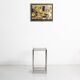 Bolster or end table in chrome steel with smoked window.