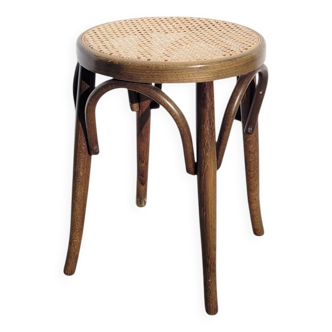 Low stool in cane and curved wood