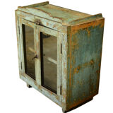 Green showcase on feet old teak wood