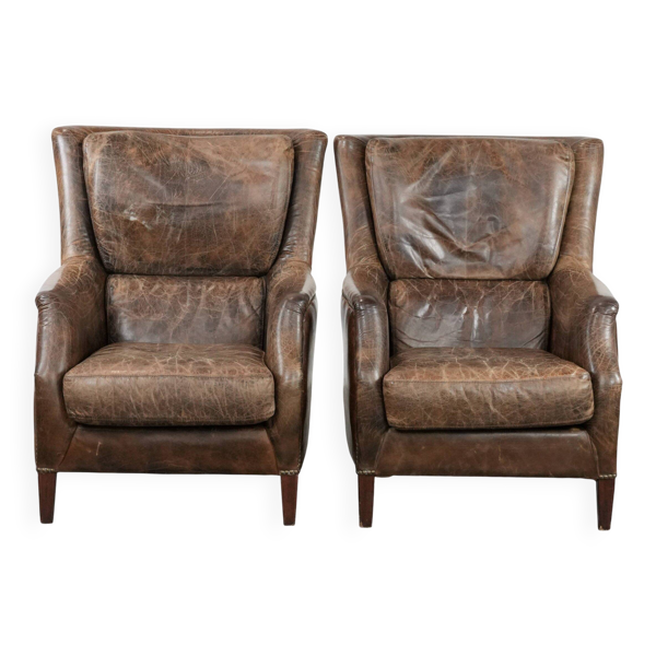 Ensemble très confortable de deux fauteuils en cuir de vache vintage.