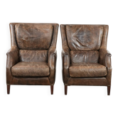 Ensemble très confortable de deux fauteuils en cuir de vache vintage.